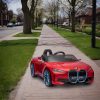 Masina electrica BMW i4 decapotabila rosie